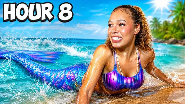 Yonna Jay in a mermaid tail on the shoreline
